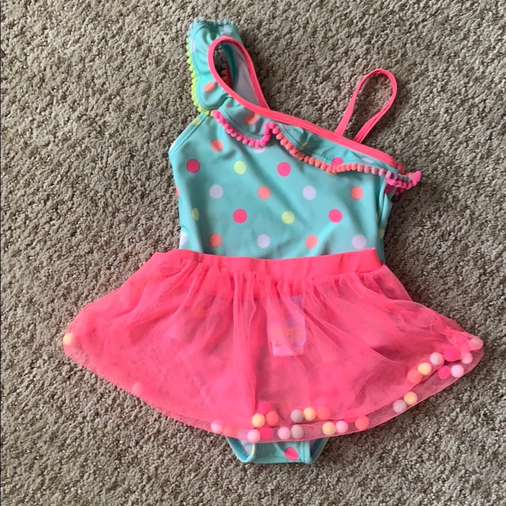 One piece swimming suit with detached skirt